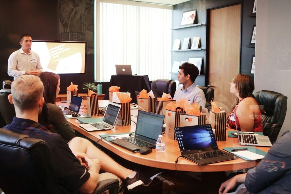 Agency presenting a proposal to a business team around a table